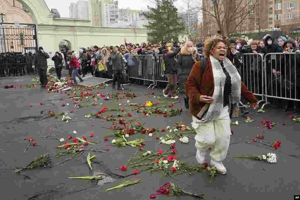 People break barriers after a van with the coffin of Russian opposition leader Alexey Navalny left the Church of the Icon of the Mother of God Soothe My Sorrows, in Moscow, Russia.