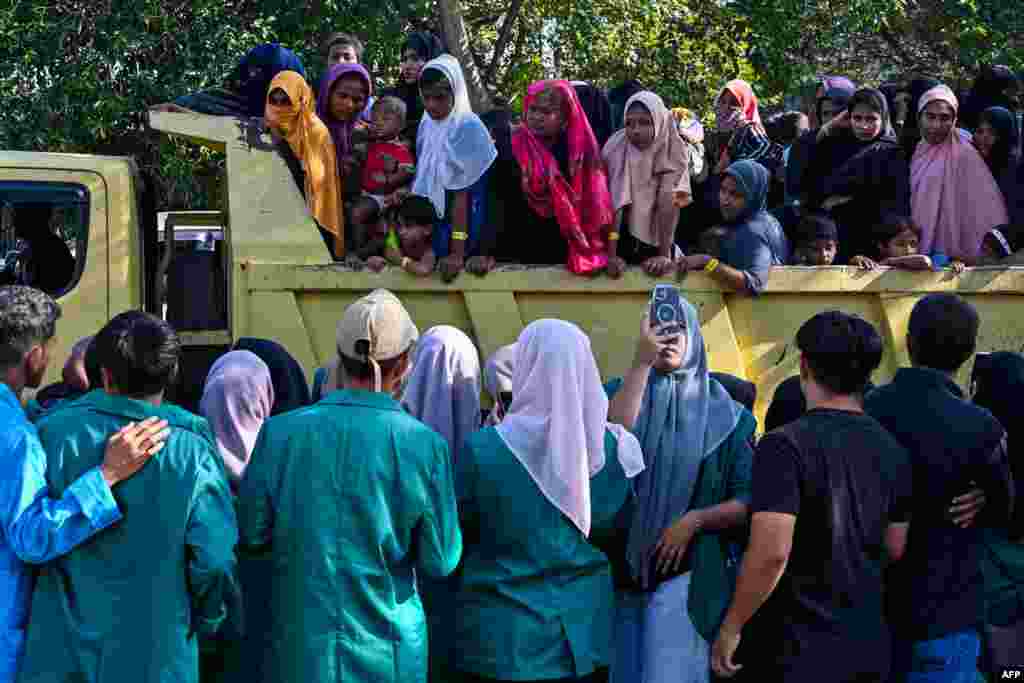 Rohingya refugees crowd into a vehicle for relocation to a nearby government building after demonstrating university students forced them out of the current government facility, in Banda Aceh. Hundreds of university students in Indonesia's westernmost province stormed a temporary shelter for more than a hundred Rohingya refugees on December 27, forcing them to leave in the latest rejection of the persecuted Myanmar minority. 