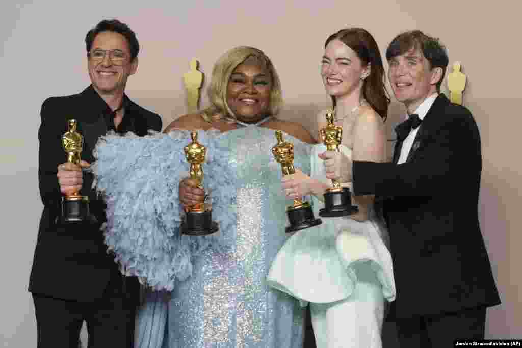from left: Robert Downey Jr., winner of the best supporting actor for "Oppenheimer," Da'Vine Joy Randolph, winner of the best supporting actress for "The Holdovers," Emma Stone, winner of the best actress for "Poor Things," and Cillian Murphy, winner of the best actor for "Oppenheimer," pose in the press room at the Oscars, March 10, 2024, at the Dolby Theatre in Los Angeles.
