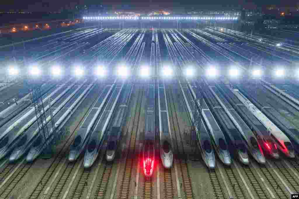 High-speed trains are lined up after undergoing maintenance in preparation for the annual Lunar New Year travel peak, at a maintenance base in Wuhan, in Chinas central Hubei province.