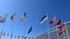 A Finnish flag is seen ready to be hoisted to join flags of NATO member countries at the alliance's headquarters in Brussels, April 4, 2023. (Cindy Spang/VOA) 