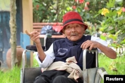 Peruvian Marcelino "Mashico" Abad gestures a day before celebrating his 124th birthday as local officials claim he might be the world's oldest ever person, in Huanuco, Peru April 4, 2024. (Pension 65/Handout via REUTERS)