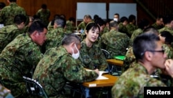 Japan Ground Self-Defence Force (JGSDF) soldiers participate in a seminar to prevent harassment at JGSDF Camp Asaka, in Tokyo, Japan April 16, 2024. (REUTERS/Sakura Murakami)