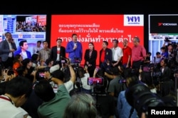 Leaders of the Pheu Thai Party speak to the media after the polling stations closed on the day of the general elections in Bangkok, Thailand, May 14, 2023. (REUTERS/Athit Perawongmetha)