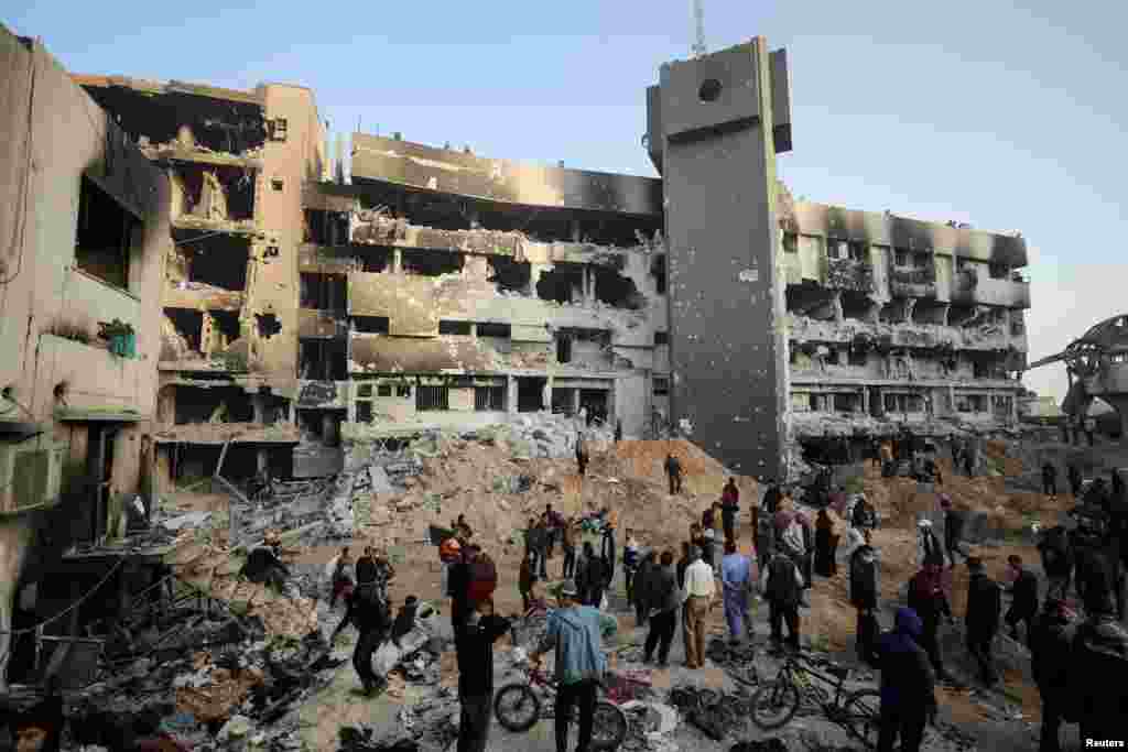 Palestinians inspect damages at Al Shifa Hospital after Israeli forces withdrew from the hospital and the area around it following a two-week operation in Gaza City.