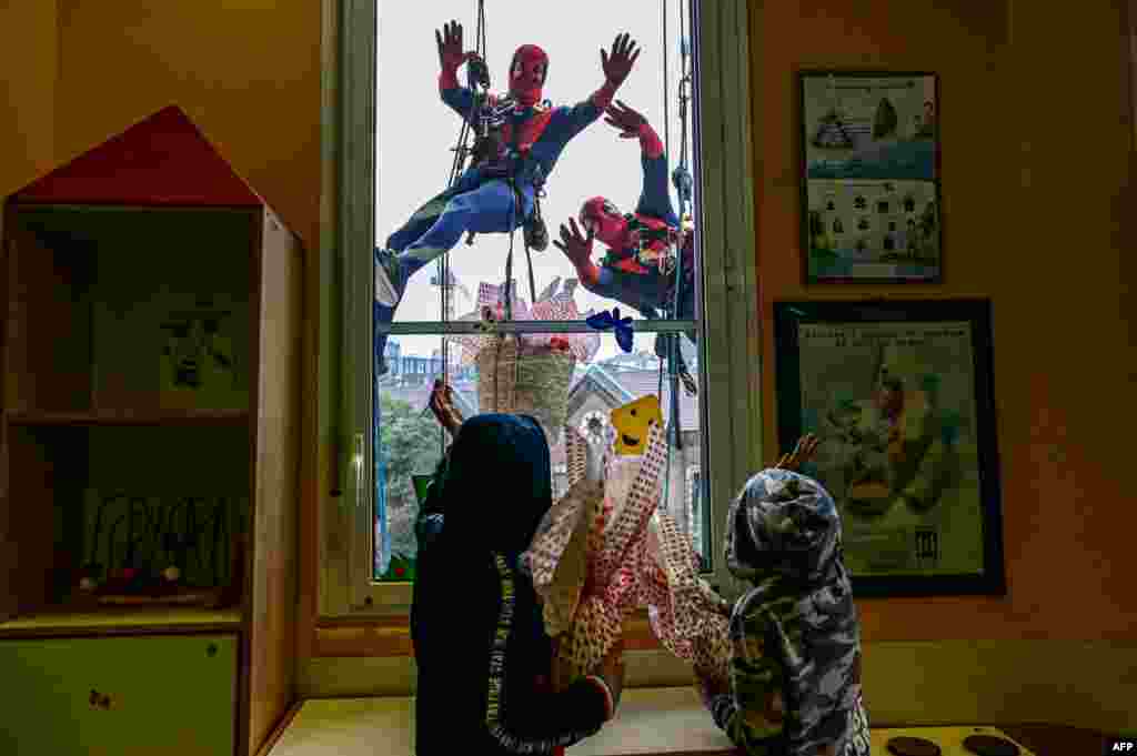People dressed as Superheroes deliver Easter eggs to children hospitalized in the pediatric ward of the De Marchi clinic, March 28, 2024 in Milan, Italy.