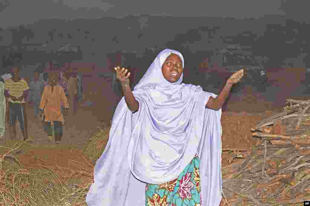 A woman cries as she calls out to the government to help and rescue school children that were kidnapped by gunmen in Chikun, Nigeria, March 7, 2024. Gunmen attacked a school in Nigeria's northwest region Thursday morning and abducted at least 287 students, the headteacher told authorities.