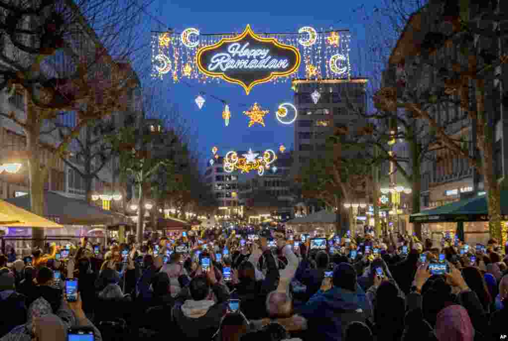 A "Happy Ramadan" sign is illuminated on the occasion of the beginning of the holy month of Ramadan in a pedestrian zone in Frankfurt, Germany.