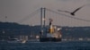 The Panama-flagged bulk carrier Navi Star carrying tons of grain from Ukraine sails along the Bosphorus Strait past Istanbul on Aug. 7, 2022, after being officially inspected. 