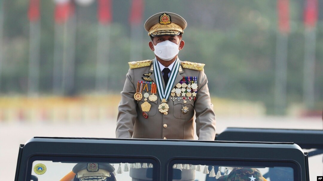 FILE - Senior Gen. Min Aung Hlaing, head of the military council, inspects officers during a parade to commemorate Myanmar's 77th Armed Forces Day in Naypyitaw, Myanmar, Sunday, March 27, 2022.