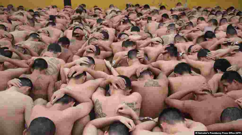 Members of the Mara Salvatrucha and Barrio 18 gangs are seen at a prison in Ciudad Barrios, El Salvador, March 28, 2022, after they were rounded up by authorities amid a sharp rise in homicide figures this past weekend.
