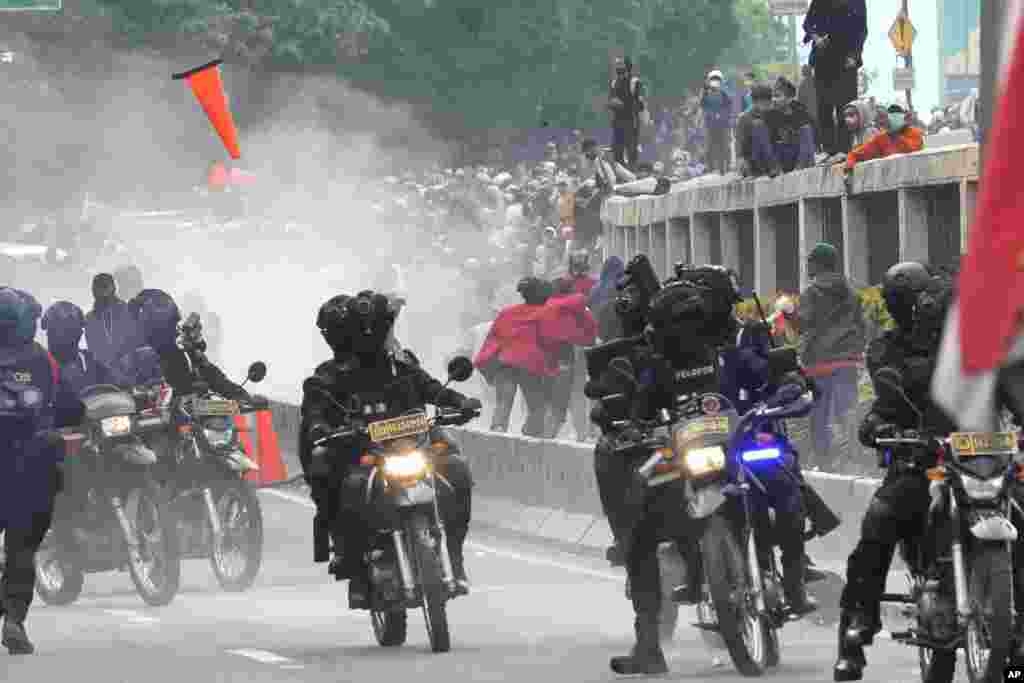 Police disperse protesters during a rally in Jakarta, Indonesia. Thousands of students marched in cities around the country to protest against rumors that the government is considering postponing the 2024 presidential election to allow President Joko Widodo to remain in office beyond the two-term legal limit, calling it a threat to the country's democracy.
