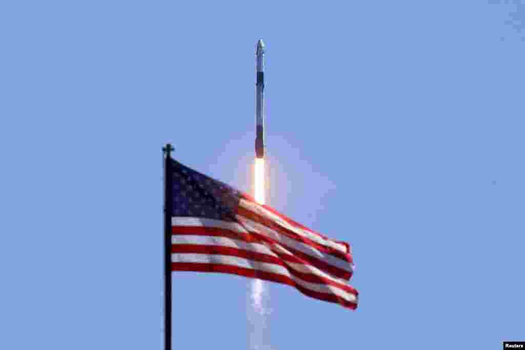 Axiom's four-man team lifts off, riding atop a SpaceX Falcon 9 rocket, in the first private astronaut mission to the International Space Station, from Kennedy Space Center in Cape Canaveral, Florida.