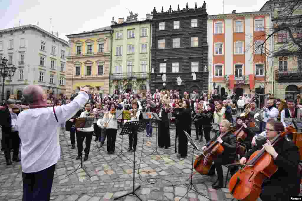 Members of the Lviv symphony orchestra play an outside concert for a "free sky" and against the ongoing Russian invasion of Ukraine, in downtown Lviv, Ukraine.