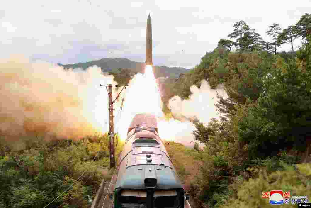 A missile is seen launched during a drill of the Railway Mobile Missile Regiment in North Korea, in this image supplied by North Korea's Korean Central News Agency.