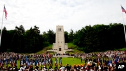 People attend a Memorial Day commemoration at the Aisne-Marne American Cemetery in Belleau, France, May 27, 2018.