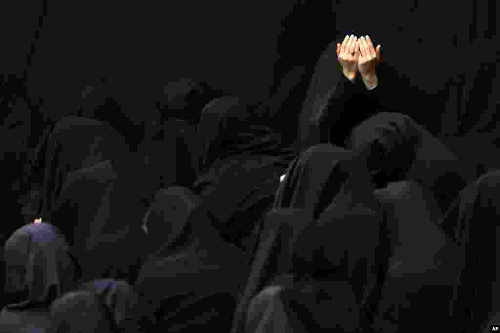 Iranian Shiite Muslim women mourn during a ceremony at Sadat Akhavi Mosque in Tehran, three days prior to the anniversary of 7th century Shi'ite Imam Hussein, the grandson of Prophet Muhammad, who was killed in a battle in Karbala in present-day Iraq.