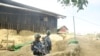 Myanmar border guard police stand guard at Goke Pi outpost in Buthidaung during a government organized media tour in Rakhine