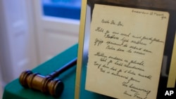 A short poem by Anne Frank, handwritten and dated in Amsterdam on March 28, 1942, is displayed at Bubb Kuyper auction house prior to the auction in Haarlem, Netherlands, Wednesday, Nov. 23, 2016.