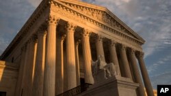  FILE - The Supreme Court in Washington, at sunset, Oct. 10, 2017. 