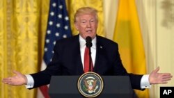 FILE - President Donald Trump speaks in the East Room of the White House in Washington, May 18,2017. 