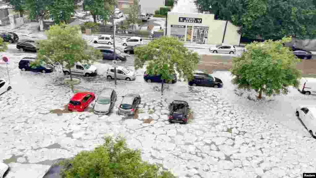 Hail flash-floods the streets in Decines-Charpieu near Lyon, France, June 23, 2021 in this still image taken from social media video. (Twitter @ant_steyer/Antoine Steyer)