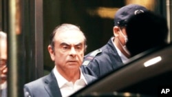 FILE - Former Nissan Chairman Carlos Ghosn leaves the Tokyo Detention Center in Tokyo, April 25, 2019.
