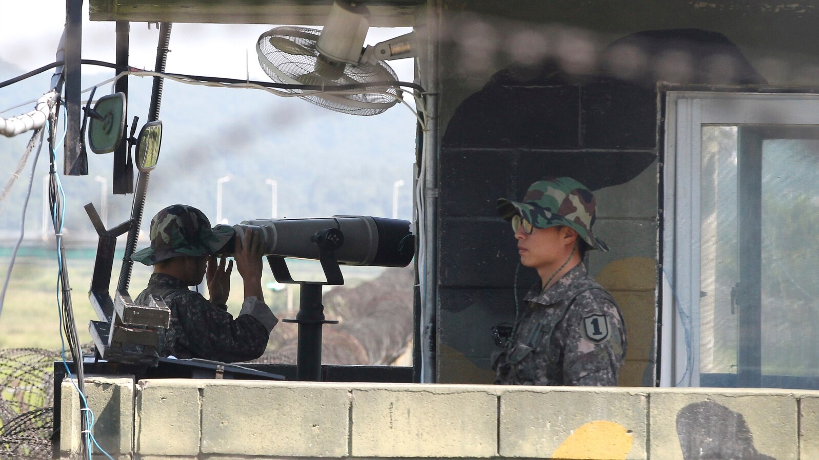 South Korean soldiers stand watch at a checkpoint in Paju, near the border with North Korea, in the wake of rocket and missile firings by Pyongyang into waters off the nation's east coast, Sept. 6, 2014.
