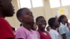 FILE - An aisle of girls at Camp GLOW (Girls Leading Our World) run by the Peace Corps, in Lilongwe, Malawi.