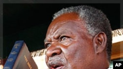 Zambia's new President Michael Sata, right, takes the oath of office on the steps of the supreme court in Lusaka, Zambia, Friday Sept. 23, 2011. Sata defeated incumbent Zambia's President Rupiah Banda in Tuesday Sept. 20 elections. 