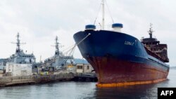 FILE - The Luna-S, a Tanzania-flagged vessel, intercepted by the French navy in international waters between Sardinia in Italy and Algeria, is seen moored in the naval base of Toulon, southern France, Oct. 15, 2013.