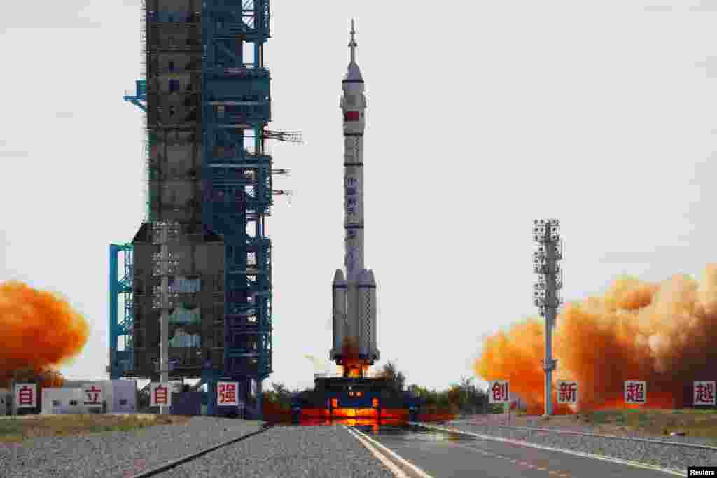 The Long March-2F Y12 rocket, carrying the Shenzhou-12 spacecraft and three astronauts, takes off from Jiuquan Satellite Launch Center for China's first manned mission to build its space station, near Jiuquan, Gansu province.