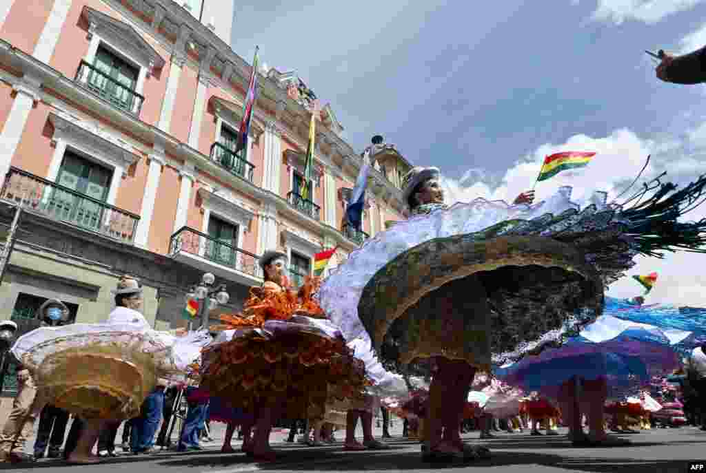 Morenada dancers perform at the Plaza de Armas during the celebrations of the Morenada National Day in La Paz, Sept. 7, 2021.