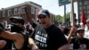 A counter protester yells at white supremacists during a rally in Charlottesville, Virginia, August 12, 2017.