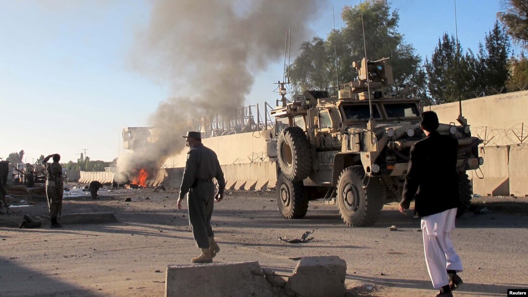 Smoke bellows after a suicide car bomb blast attacked a military convoy in Lashkar Gah, Helmand province, Afghanistan, Nov. 15, 2015.