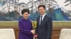 中国国务院副总理韩正与香港行政长官林郑月娥握手