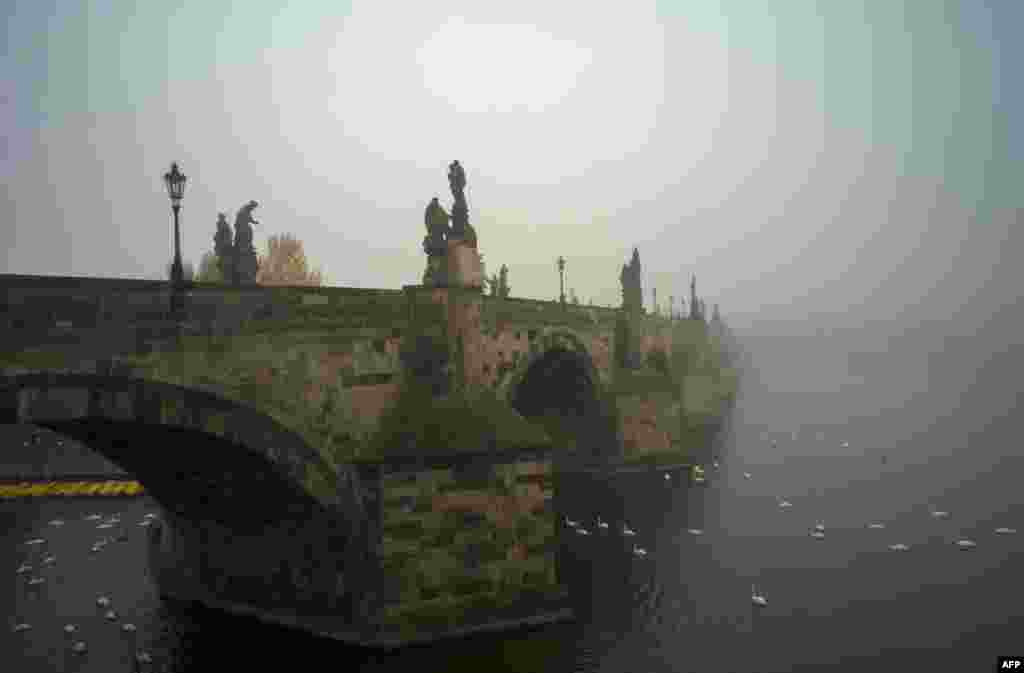 The Charles Bridge is pictured on a foggy morning in Prague.