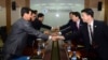 11일 개성공단 종합지원센터에서 열린 개성공단 남북공동위원회 2차 회의에서 남북한 대표단이 회담에 앞서 악수하고 있다.