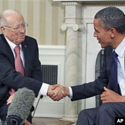 FILE - President Barack Obama meets with Prime Minister Beji Caid Essebsi of Tunisia in the Oval Office at the White House in Washington, Oct. 7, 2011.