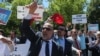 Supporters of Turkish President Recep Tayyip Erdogan react to anti-Erdogan supporters outside the White House in Washington, D.C., May 16, 2017. Erdogan was meeting with U.S. President Donald Trump.