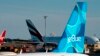 ARCHIVO - Un avión de JetBlue se ve estacionado en la pista del Aeropuerto Internacional John F. Kennedy el martes 28 de junio de 2022, en Nueva York.