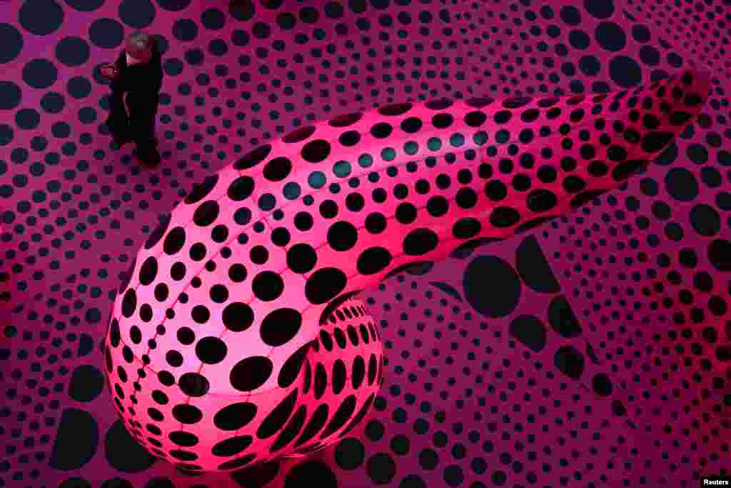 A man visits "A Retrospective," an exhibition of the Japanese artist Yayoi Kusama at the museum Gropius Bau while COVID-19 restrictions continue to ease in Berlin, Germany.