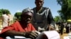 FILE - An elderly woman casts her vote in Malawi's general election in Machinga district, north of the commercial capital, Blantyre.