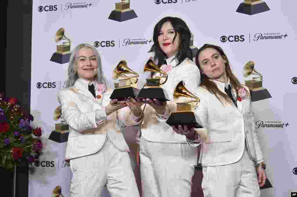 (from left) Phoebe Bridgers, Lucy Dacus, and Julien Baker of Boygenius pose in the press room with the awards for best rock performance and best rock song for "Not Strong Enough," and best alternative music album for "The Record" during the 66th annual Grammy Awards, Feb. 4, 2024, in Los Angeles, California. 