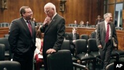 FILE - Brian Benczkowski, Senate Judiciary committee minority staff director, left, talks with committee chairman Sen. Patrick Leahy, D-Vt. on Capitol Hill in Washington, June 11, 2009.