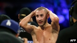 FILE - Maxim Dadashev of Russia waits for the decision after a super-lightweight bout in Las Vegas, Oct. 20, 2018. 