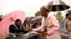 An old woman receives a mark on her finger with indelible ink prior to vote for Malawi's Tripartite elections at Malemia School Polling center, the home village of the incumbent president, May 20, 2014.