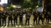 FILE - Police hold their lines in uptown Charlotte during a protest of the police shooting of Keith Scott in Charlotte, North Carolina, Sept. 21, 2016.
