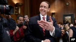 FILE - Deputy Attorney General-designate, federal prosecutor Rod Rosenstein, arrives on Capitol Hill in Washington, March 7, 2017, to testify at his confirmation hearing before the Senate Judiciary Committee. 
