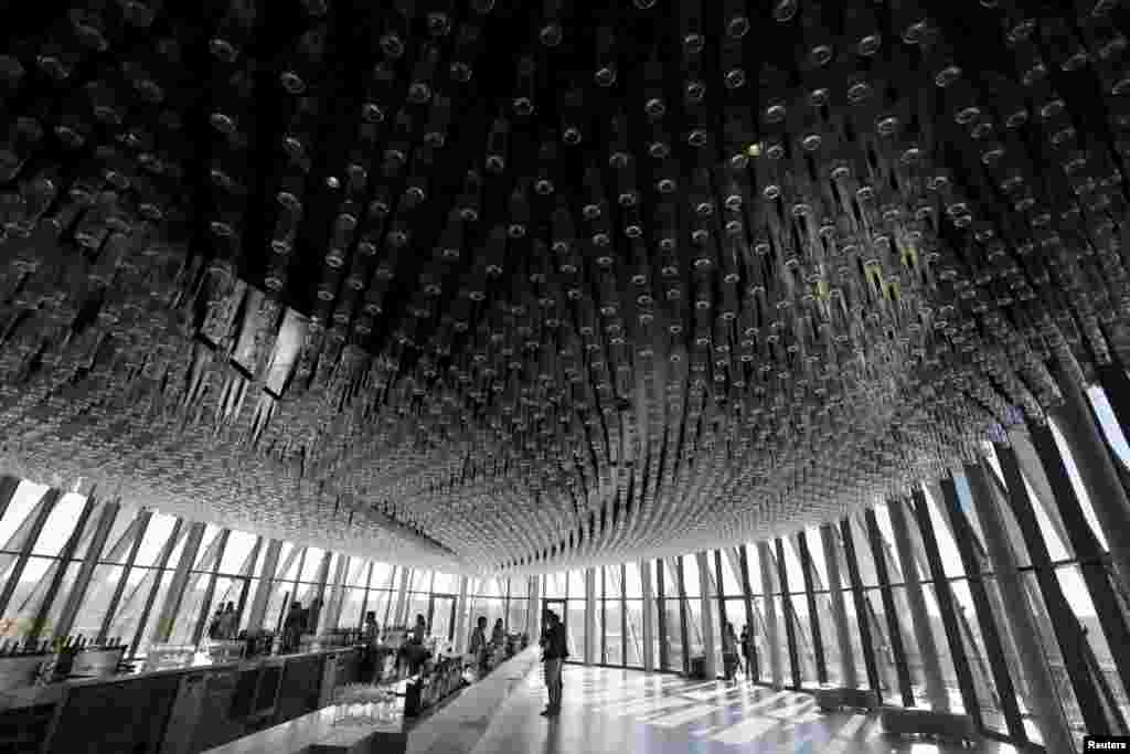 People visit La Cite du Vin (the City of Wine), a Center for Wine and Civilizations devoted to the cultures of wine, in Bordeaux, France.